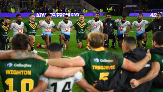 Fiji and Australia join together in a post-match prayer circle after the Kangaroos’ 34-point win in Leeds.