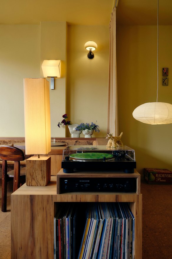 The nostalgic interiors include a record player. 