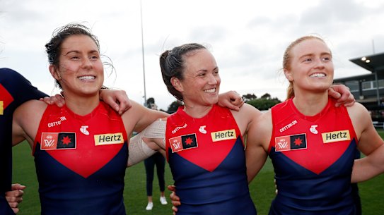 Libby Birch, left, pictured last season with Demons teammates Daisy Pearce, centre, and Blaithin Mackin.