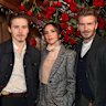 Brooklyn (left), Victoria and David Beckham.
