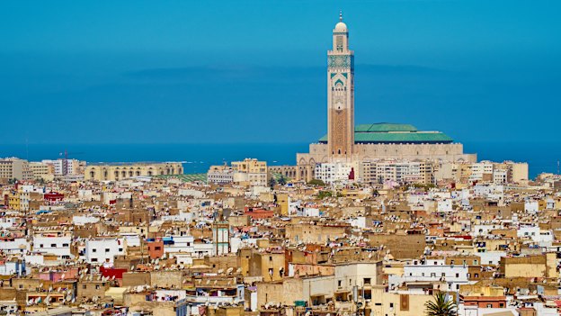 The 210-meter minaret of Hassan II mosque towers over the squat rooftops of the Casablanca’s old Medina.
