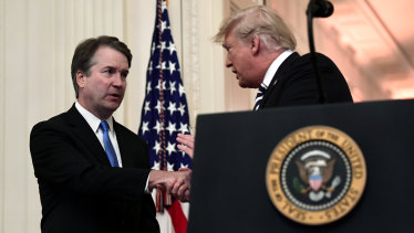 Donald Trump with Brett Kavanaugh before the  swearing-in ceremony.