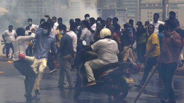 Pro-government and anti-government protestors clash in Sri Lanka outside the president’s office in Colombo earlier this month.