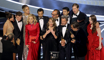 Cast and crew - Emilia Jones, Daniel Durant, Sian Heder, Marlee Matlin, Eugenio Derbez, Fabrice Gianfermi, Patrick Wachsberger, Justin Maurer, Philippe Rousselet, Troy Kotsur, and Amy Forsyth - accept the best picture award for CODA at the Oscars.
