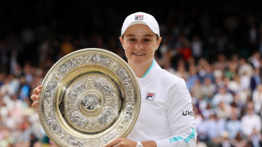 Ash Barty lifts the Venus Rosewater trophy after winning the ladies’ singles final at Wimbledon in 2021. 