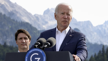 US President Joe Biden speaks at the  G7 summit in Bavaria on Sunday as  Canadian Prime Minister Justin Trudeau is looks on.