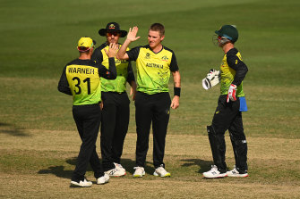 Adam Zampa (centre) celebrates taking another wicket in Australia’s defeat of Bangladesh.