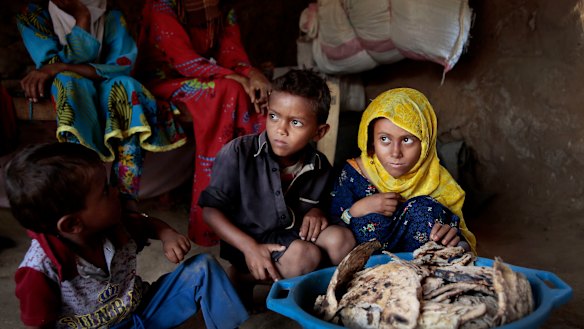 A family at a shelter in Aslam, Hajjah, Yemen. The country's humanitarian crisis is deepening, aid agencies have warned.