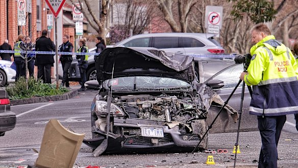 Police at the scene of the brawl and car accident in Collingwood.