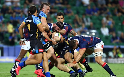 James Hanson runs the ball for the Rebels against the Force.