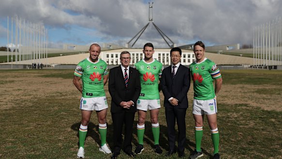 Huawei Australia chairman John Lord and chief executive Hudson Liu with Canberra Raiders players.