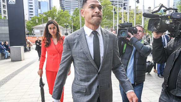 Israel Folau walking into the Federal Court in December last year.