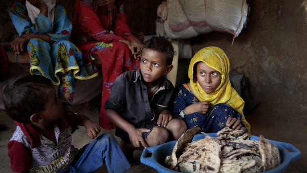 A family at a shelter in Aslam, Hajjah, Yemen. The country's humanitarian crisis is deepening, aid agencies have warned.