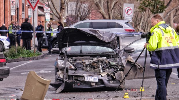 Police at the scene of the brawl and car accident in Collingwood.