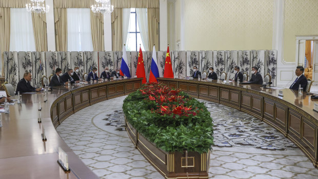 Russian President Vladimir Putin, left, and Chinese President Xi Jinping, right, talk during their meeting in Samarkand, Uzbekistan.