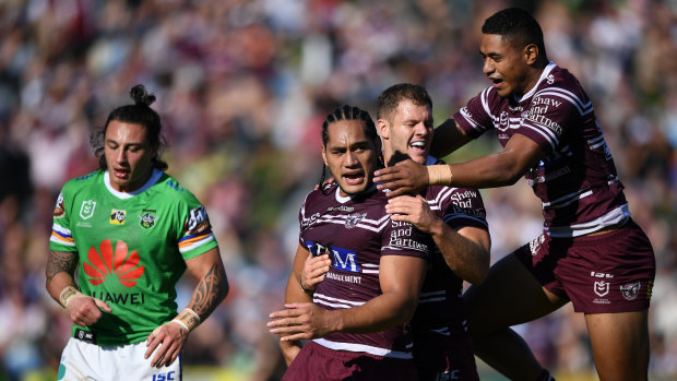 Fightback: Manly teammates celebrate Martin Taupau's try for the Sea Eagles at Lottoland.