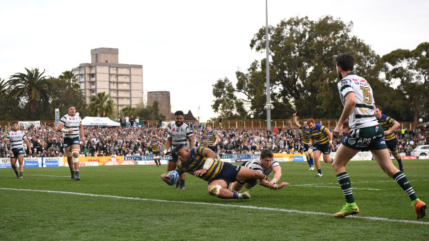 Tolu Latu scores a try for Sydney University on Saturday at North Sydney Oval.