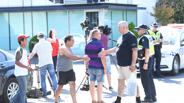 Mick Gatto (right) outside Melbourne Pavilion on Saturday prior to collecting his car from the Kensington venue, where a man was shot dead and two others were wounded on Friday night.