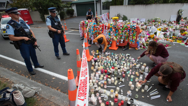 Candles are lit in a vigil for the victims of Friday's attacks.