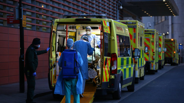 The pandemic raged through Britain. Ambulances lined up at a hospital in January.