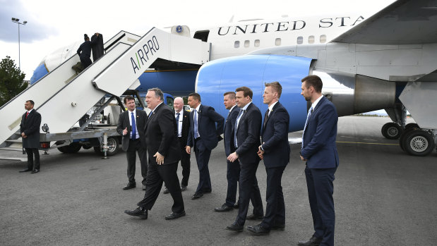 US Secretary of State Mike Pompeo, centre, poses with security officers of the Finnish police as he prepares to leave Rovaniemi, Finland, after attending the 11th Ministerial Meeting of the Arctic Council. 