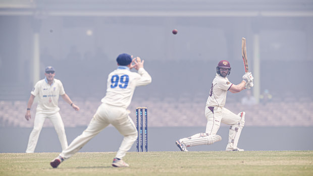 Mathew Gilkes picks the ball out through the smoke to take the catch and dismiss Michael Neser off Harry Conway. 