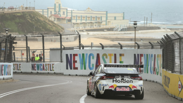 Newcastle Beach provides a stunning backdrop to Jamie Whincup on his way to victory in the Newcastle 500 on Sunday. 