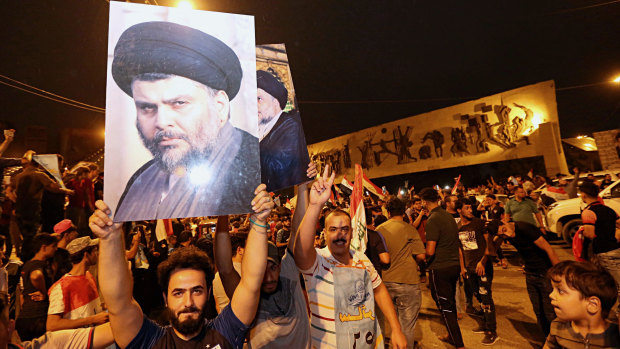 Followers of Shiite cleric Muqtada al-Sadr celebrate in Tahrir Square in Baghdad early on Monday, May 14.