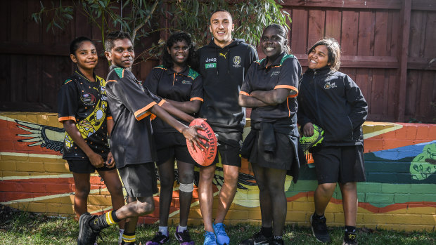 Richmond's Shai Bolton with kids from the Melbourne Indigenous Transitional School, from left. Rhiannon Baker, Adam Minjin, Serina Gurriwiwi, Pauline Managaygay and Marley Dolby.