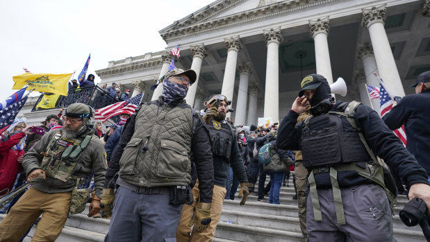 Members of the Oath Keepers extremist group stand on the east front of the US Capitol on January 6, 2021. 