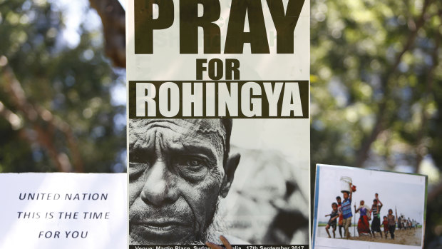 Rohingya supporters hold placards during a protest against Aung San Suu Kyi as she visits Australia in March.