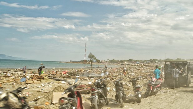 Motorbikes that ran out of fuel are left at the beachfront.