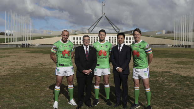 Huawei Australia chairman John Lord and chief executive Hudson Liu with Canberra Raiders players.