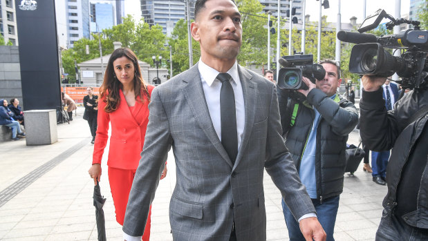 Israel Folau walking into the Federal Court in December last year.