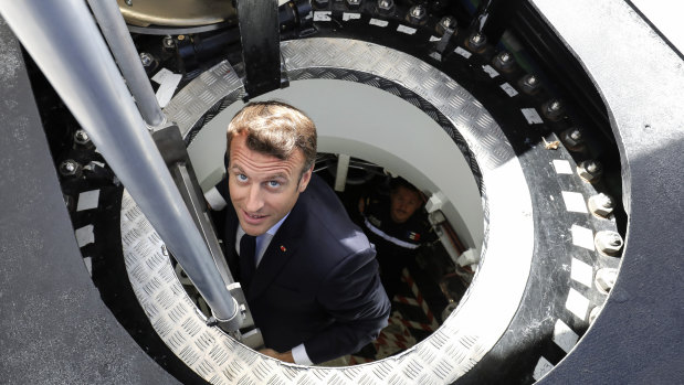 French President Emmanuel Macron inspects a new nuclear submarine at the Cherbourg shipyard in 2019.