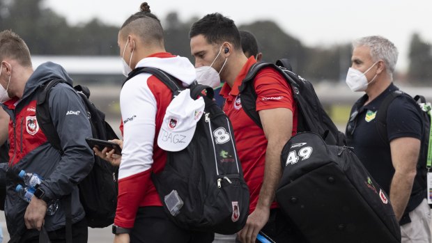 Corey Norman joins Dragons players on their flight to Queensland on Wednesday.