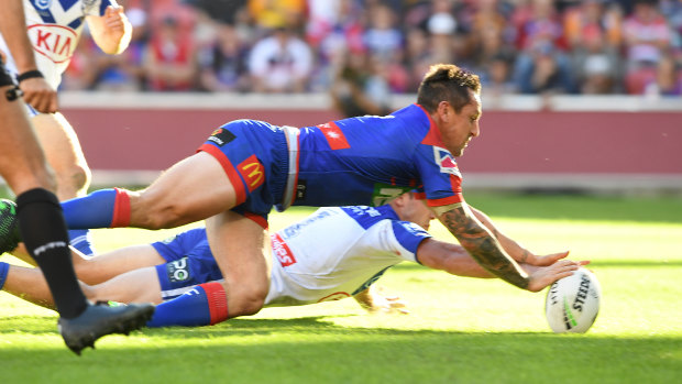 Try time: Mitchell Pearce touches down.