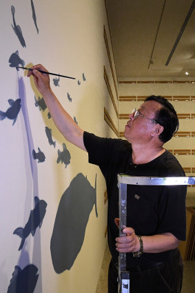 Artist Guan Wei during the installation of his show at the MCA.