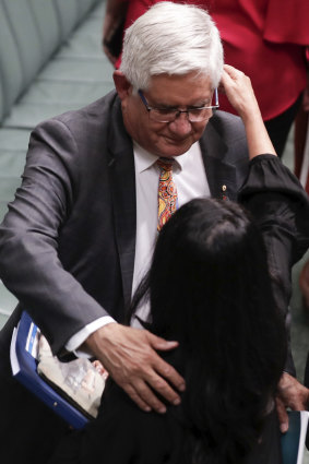 Minister for Indigenous Australians Ken Wyatt embraces Linda Burney after the Prime Minister's Closing the Gap statement to the House of Representatives on February 12.