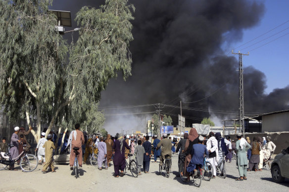 Smoke rises after fighting between the Taliban and Afghan security personnel, in Kandahar, south-west of Kabul.