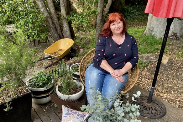 Amanda De George in her garden in Thirroul, NSW.