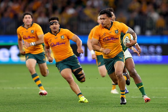 Len Ikitau makes a break to score a try against the Springboks.