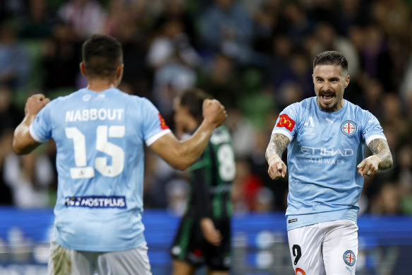 Jamie Maclaren celebrates with Andrew Nabbout on Friday night.