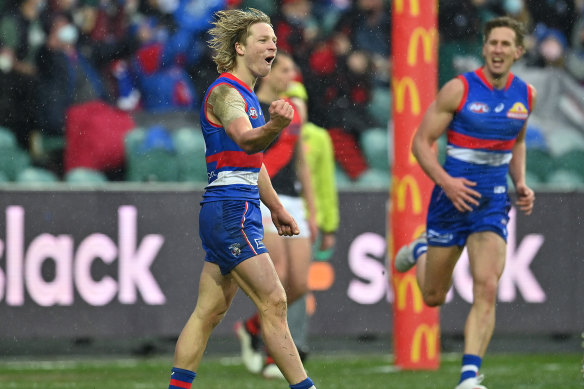 Cody Weightman of the Bulldogs celebrates kicking a goal.