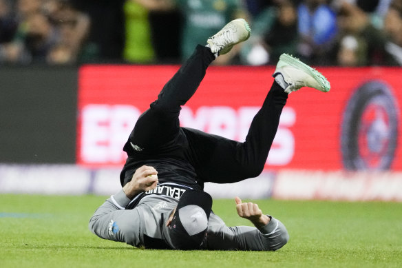 New Zealand’s Glenn Phillips takes a catch to dismiss Pakistan’s Mohammad Rizwan.