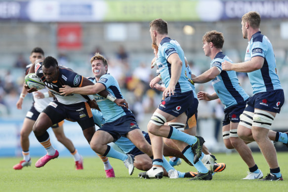 Tevita Kuridrani of the Brumbies is tackled by NSW playmaker Will Harrison during round seven of Super Rugby, just before the season was suspended.