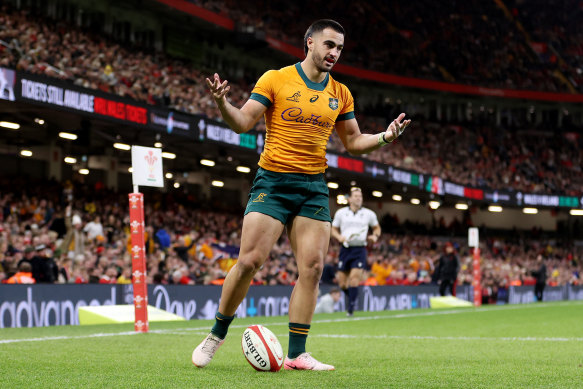 Tom Wright celebrates after scoring the Wallabies sixth try.