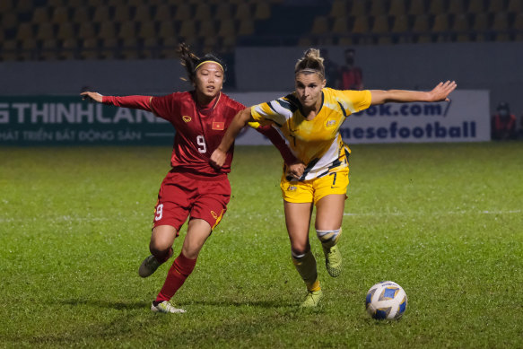 Australia's Steph Catley challenges Huynh Nhu for the ball during the qualifier.