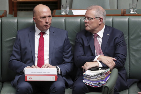 Prime Minister Scott Morrison, right, says he is not aware of anything to show Peter Dutton broke the rules of a grants program that directed money overwhelmingly to coalition or marginal electorates ahead of the 2019 election.