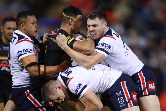 Rookie Panther Taylan May is met by the Sydney Roosters defence.